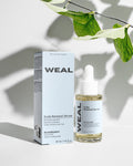WEAL Scalp Renewal Serum bottle and packaging on a light background with leaves.
