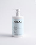 WEAL shampoo bottle on a light gray background