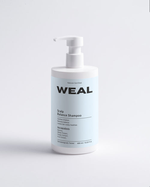 WEAL shampoo bottle on a light gray background
